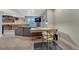 Finished basement with a desk area, comfortable seating, and space for recreation at 13903 Hillsboro Dr, Parker, CO 80134