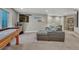 Finished basement featuring a comfortable seating area, television, and carpeted floor at 13903 Hillsboro Dr, Parker, CO 80134