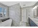 Elegant bathroom featuring a standalone tub, decorative tile, and modern fixtures at 13903 Hillsboro Dr, Parker, CO 80134