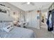 Bright bedroom with natural light, stylish decor, comfortable carpet, and adjacent closet for ample storage at 13903 Hillsboro Dr, Parker, CO 80134