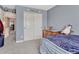 Bedroom featuring neutral walls, comfortable carpet, and closet doors, creating a comfortable atmosphere at 13903 Hillsboro Dr, Parker, CO 80134