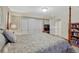 Bedroom with a four-poster bed, closet, and neutral color scheme at 13903 Hillsboro Dr, Parker, CO 80134