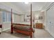 Bedroom with a four-poster bed, neutral color scheme, and lots of natural light at 13903 Hillsboro Dr, Parker, CO 80134