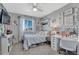 Bedroom with a window with natural light, stylish decor, comfortable carpet, and adjacent closet at 13903 Hillsboro Dr, Parker, CO 80134