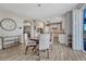 Bright breakfast nook with a round table and a view into the open kitchen at 13903 Hillsboro Dr, Parker, CO 80134