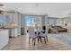 Bright dining area adjacent to kitchen features sliding glass door to outside at 13903 Hillsboro Dr, Parker, CO 80134