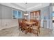 Elegant dining room with a large wooden table, stylish chairs, and a decorative hutch at 13903 Hillsboro Dr, Parker, CO 80134