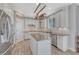 Modern kitchen featuring white cabinets, stainless steel appliances, and a granite island at 13903 Hillsboro Dr, Parker, CO 80134