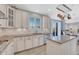 Bright kitchen featuring white cabinetry, granite countertops, and stainless steel appliances at 13903 Hillsboro Dr, Parker, CO 80134