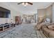 Open concept living room flows into the eat-in kitchen with wood floors and modern fixtures at 13903 Hillsboro Dr, Parker, CO 80134
