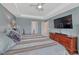 Bright main bedroom boasts a tray ceiling, carpet floors, and ample natural light at 13903 Hillsboro Dr, Parker, CO 80134