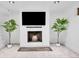 Basement recreation area with a modern fireplace and large TV at 9040 Yucca Way, Thornton, CO 80229