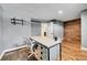 Finished basement bedroom with wood floors and built-in shelving at 9040 Yucca Way, Thornton, CO 80229