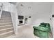 Finished basement features a fireplace, large TV, and comfortable seating at 9040 Yucca Way, Thornton, CO 80229