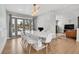 Bright dining room with a white table and chairs near the living room at 9040 Yucca Way, Thornton, CO 80229