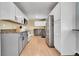 Kitchen with granite countertops and gray cabinets at 9040 Yucca Way, Thornton, CO 80229