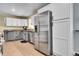 Modern kitchen with stainless steel appliances and granite countertops at 9040 Yucca Way, Thornton, CO 80229