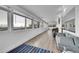 Spacious living area with large windows and wood floors at 9040 Yucca Way, Thornton, CO 80229