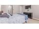 Bedroom featuring a queen bed, TV, and neutral decor at 24043 E Florida Ave, Aurora, CO 80018