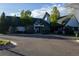 Well-maintained community clubhouse with lush landscaping, a welcoming entrance, and ample parking spaces at 24043 E Florida Ave, Aurora, CO 80018