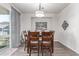 Well-lit dining room featuring modern chandelier, stylish decor, and luxury vinyl flooring at 24043 E Florida Ave, Aurora, CO 80018