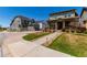 View of home with manicured lawn and walkway leading to inviting covered porch at 24043 E Florida Ave, Aurora, CO 80018