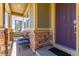 Cozy front porch with stone accents and seating with a protected entrance at 24043 E Florida Ave, Aurora, CO 80018