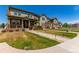 Well-manicured front lawn of attractive home with covered porch in quiet neighborhood at 24043 E Florida Ave, Aurora, CO 80018