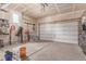 Spacious two-car garage with ample storage space and a window for natural light, perfect for organization at 24043 E Florida Ave, Aurora, CO 80018