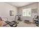 Exercise room with treadmill, stationary bike, and a mirror at 24043 E Florida Ave, Aurora, CO 80018