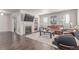 Cozy living room with a fireplace, soft carpet, and lots of natural light at 24043 E Florida Ave, Aurora, CO 80018