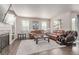 Comfortable living room with hardwood floors, fireplace, and modern decor at 24043 E Florida Ave, Aurora, CO 80018