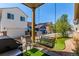 Charming patio with a porch swing, outdoor grill and landscaped yard enhances outdoor living and entertaining at 24043 E Florida Ave, Aurora, CO 80018