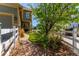 Landscaped side yard with green grass and decorative brick walkway enhances the home's curb appeal at 24043 E Florida Ave, Aurora, CO 80018