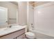This full bathroom features a single sink vanity and shower over tub at 274 Marlowe Dr, Erie, CO 80516