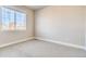 Neutral bedroom with large window, plush carpet, and view of neighborhood at 274 Marlowe Dr, Erie, CO 80516