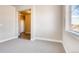 Light filled bedroom with neutral carpet and views of the neighborhood at 274 Marlowe Dr, Erie, CO 80516