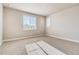Bright bedroom with carpet and large windows overlooking the neighborhood at 274 Marlowe Dr, Erie, CO 80516