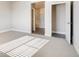 Open and bright bedroom with doorway to a full ensuite bathroom at 274 Marlowe Dr, Erie, CO 80516