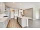 Bright kitchen with white cabinets, quartz countertops and stainless steel appliances at 274 Marlowe Dr, Erie, CO 80516