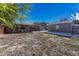 View of backyard, detached garage, and covered patio at 1957 Hanover St, Aurora, CO 80010