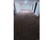 Spacious basement featuring neutral carpeting, white walls and ample natural light at 1977 S Yates S St, Denver, CO 80219