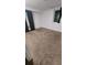 Cozy bedroom features plush carpet, natural light, and closet with mirrored doors at 1977 S Yates S St, Denver, CO 80219