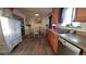 Well-lit dining area with stylish decor, wood floors, and a modern color scheme at 1977 S Yates S St, Denver, CO 80219