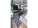 Well-appointed living room with plush rug, stylish furniture, and modern decor at 1977 S Yates S St, Denver, CO 80219