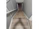 Carpeted staircase leading to the next level of the home at 1977 S Yates S St, Denver, CO 80219