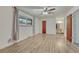 Light-filled bedroom with wood-look flooring, a window, and neutral-colored walls at 544 S Xenon Ct, Lakewood, CO 80228
