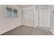 Bright bedroom featuring neutral walls, plush carpeting, and a large closet with ample storage space at 544 S Xenon Ct, Lakewood, CO 80228