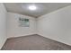Bedroom with neutral walls, carpeting, and a window at 544 S Xenon Ct, Lakewood, CO 80228