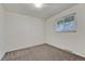 Cozy bedroom with carpet, a window, and neutral-colored walls at 544 S Xenon Ct, Lakewood, CO 80228